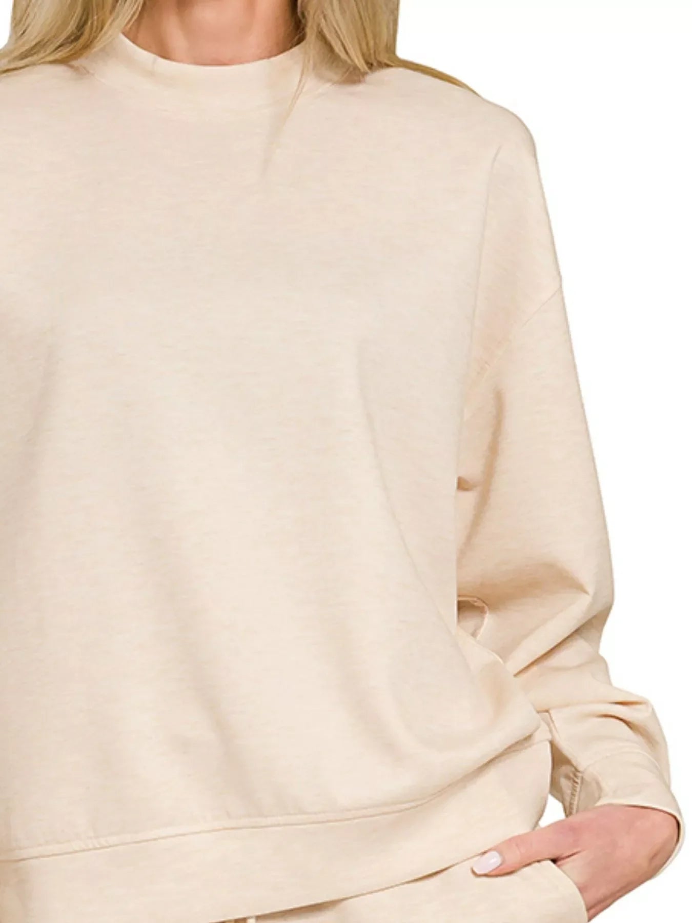 Cream oversized sweatshirt with relaxed fit, soft fabric, and cozy crew neck for everyday comfort