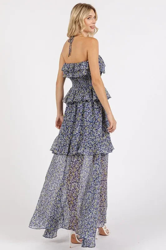 Boho floral maxi dress with ruffled layers and halter neck, perfect for trendy, happy summer vibes