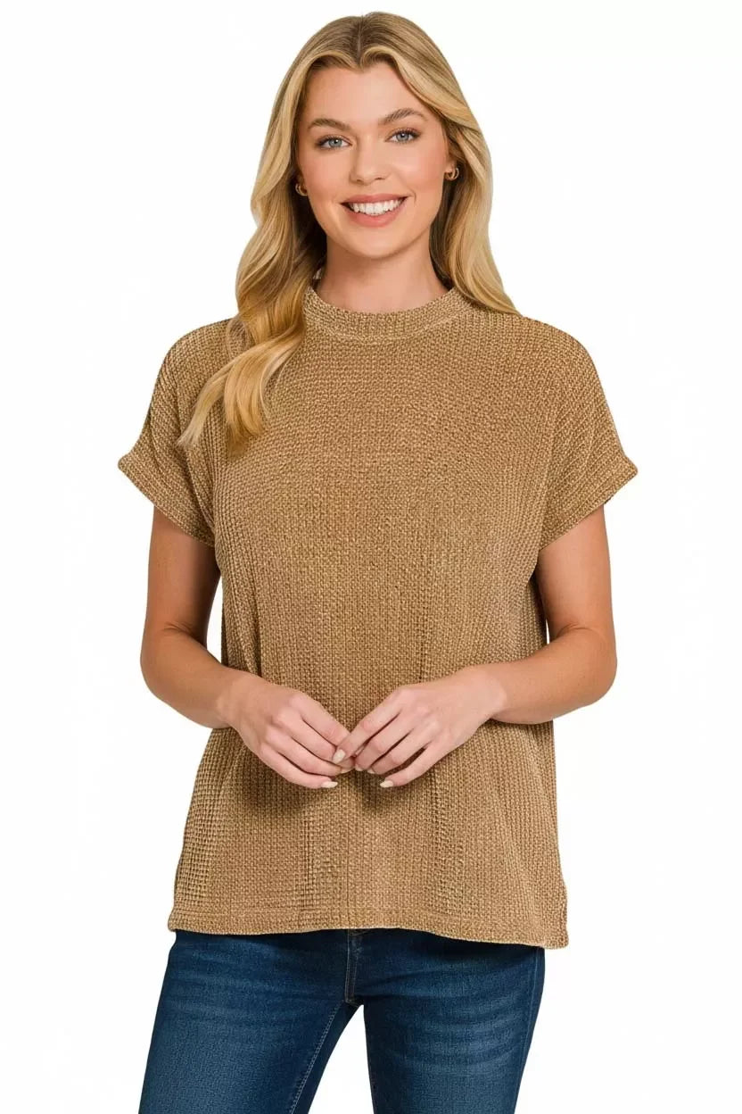 Women's cozy tan textured knit top with short sleeves, styled with jeans for a trendy, comfortable look.