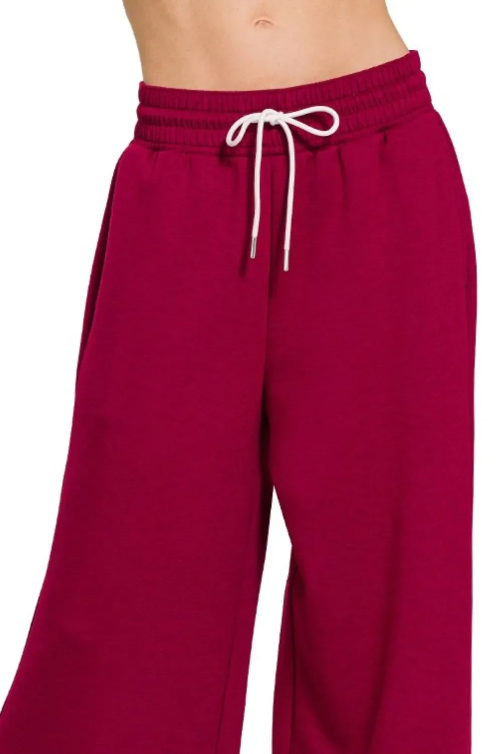Burgundy wide-leg sweatpants with white drawstring waist, comfy and trendy for casual wear.