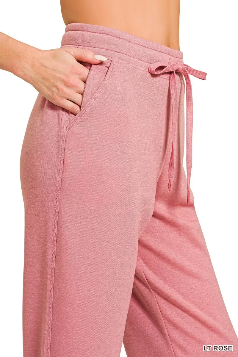 Light rose drawstring jogger pants with side pocket, soft comfy fit for casual wear