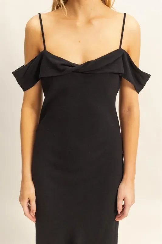 Black off-shoulder dress with ruffle detail, trendy and elegant for any occasion