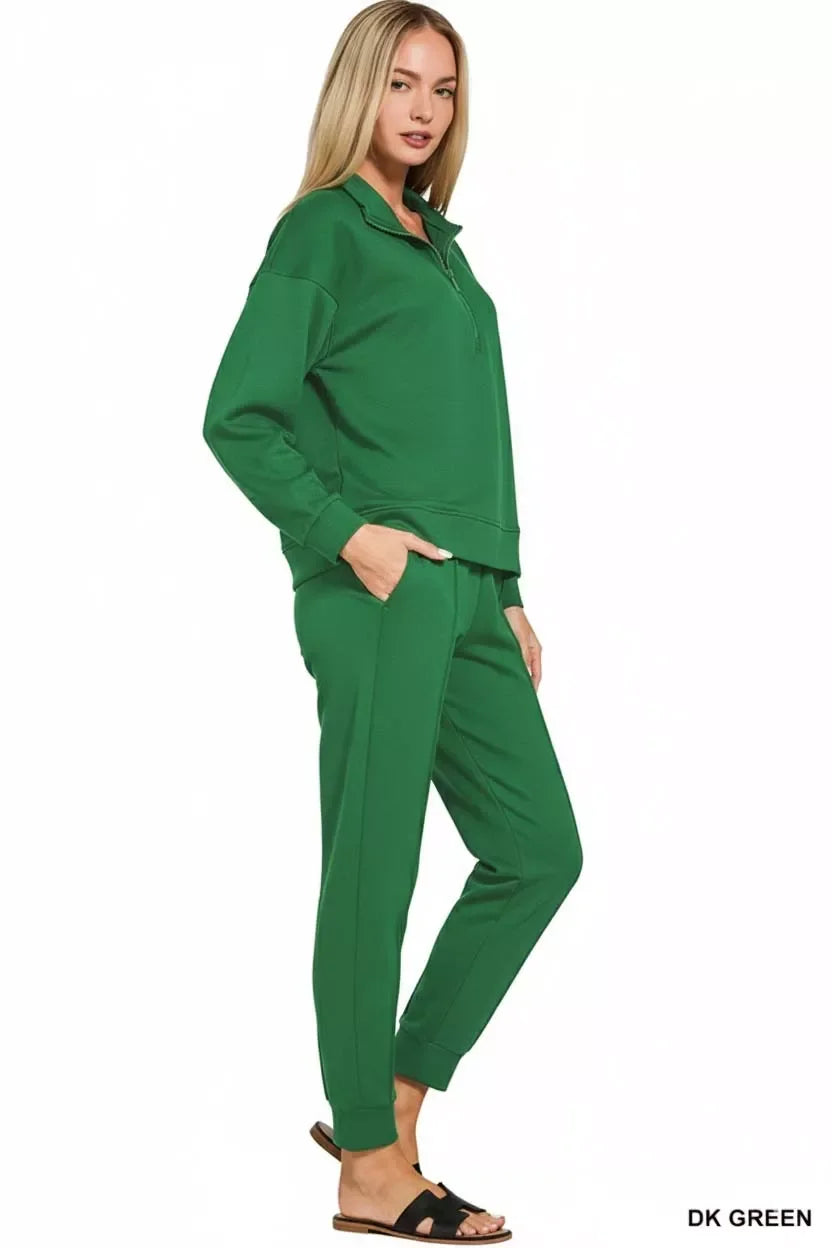Dark green women's lounge set with quarter-zip top and jogger pants, cozy and trendy for casual wear
