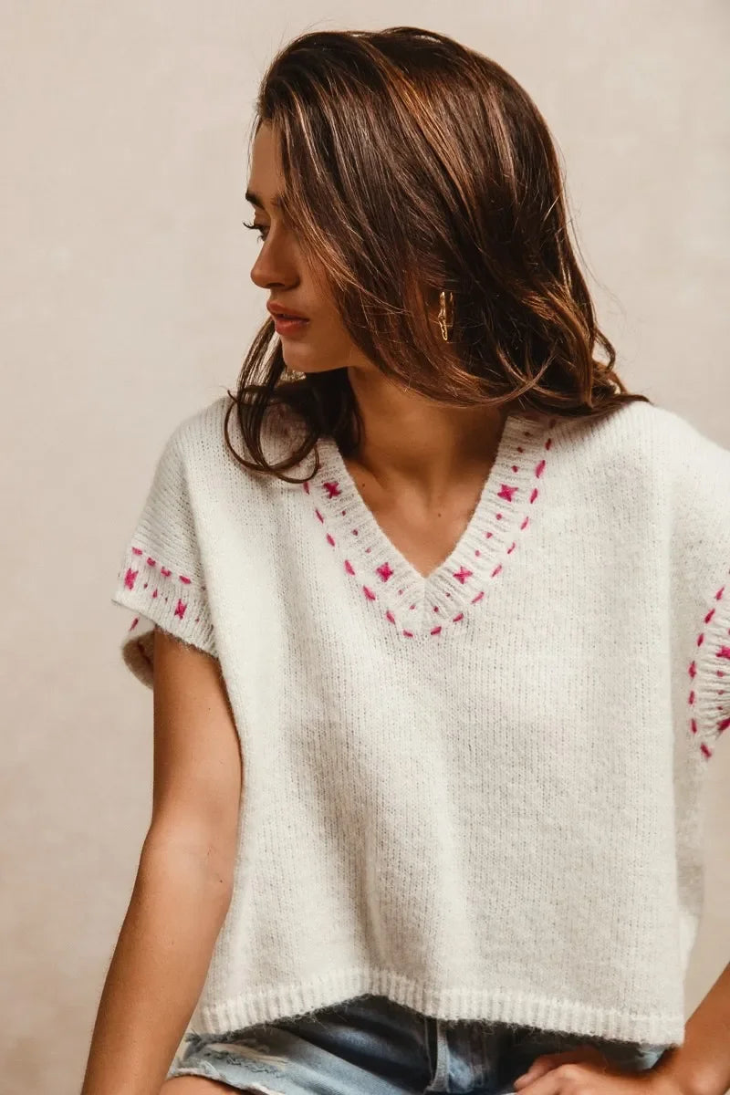 Cream V-neck sweater with pink star embroidery, cozy knit top for women