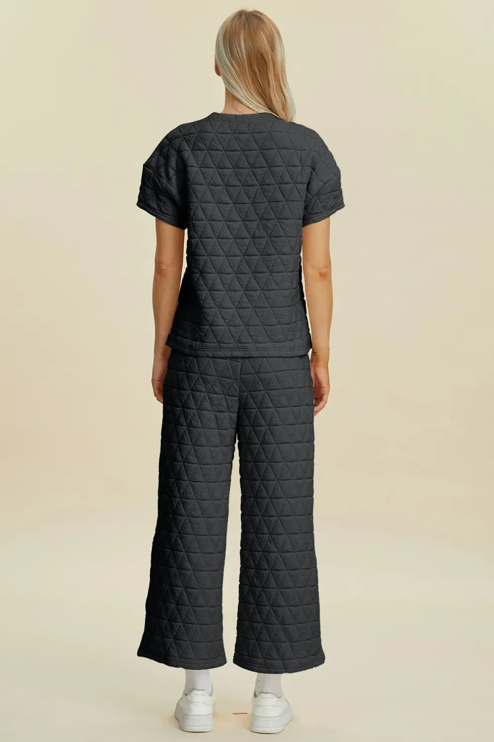Black quilted pajama set with wide-leg pants and short sleeves, cozy and trendy sleepwear